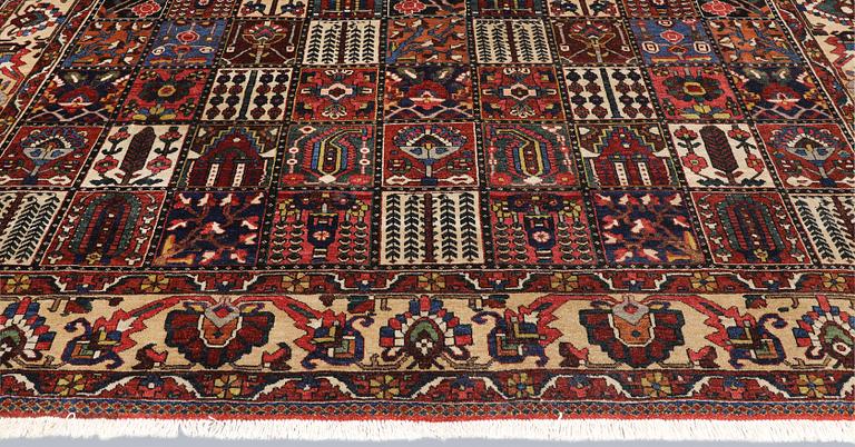 A semi-antique Baktiari carpet, approx. 360 x 308 cm.