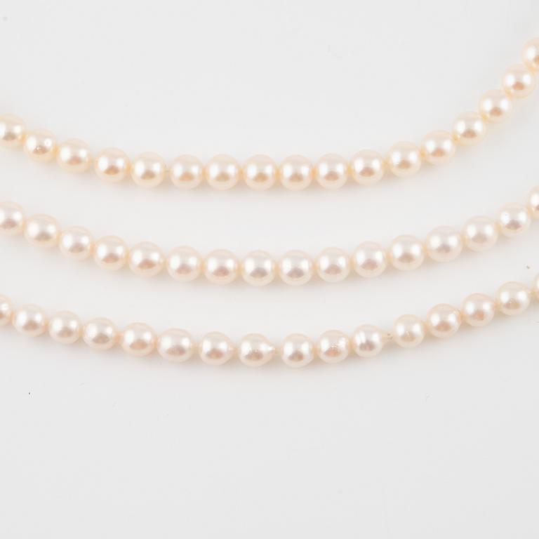 Three strands of cultured pearls, without clasps.