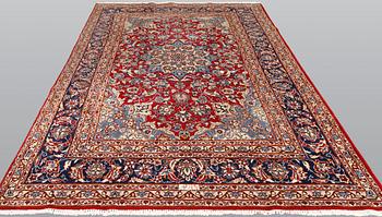 A signed Kashan carpet, ca 313 x 195 cm.