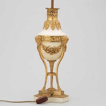 A French Louis XVI-style late 19th century table lamp.