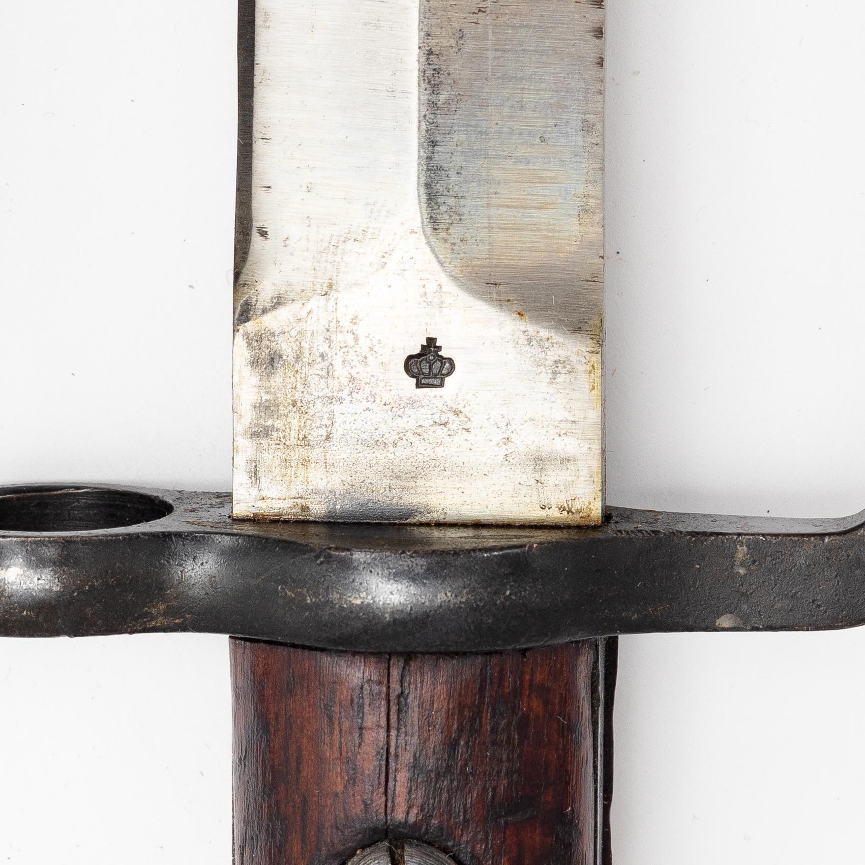 Three Swedish bayonets with scabbards.