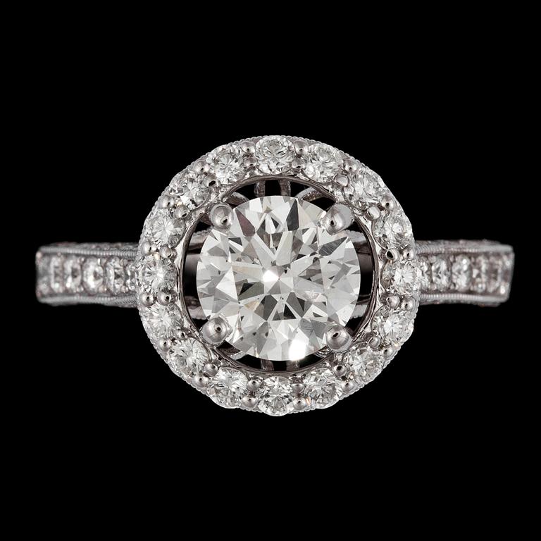 A brilliant cut diamond ring, 1.51 cts, and smaller brilliant cut diamonds, tot. 1.47 cts.