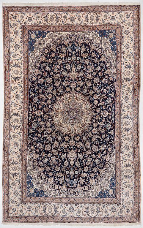 A Nain part silk carpet, c. 535 x 340 cm.