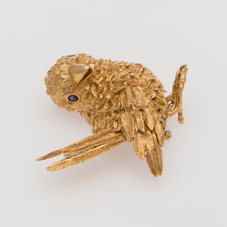 BROSCH, 18K guld, fasettslipade safirer.
