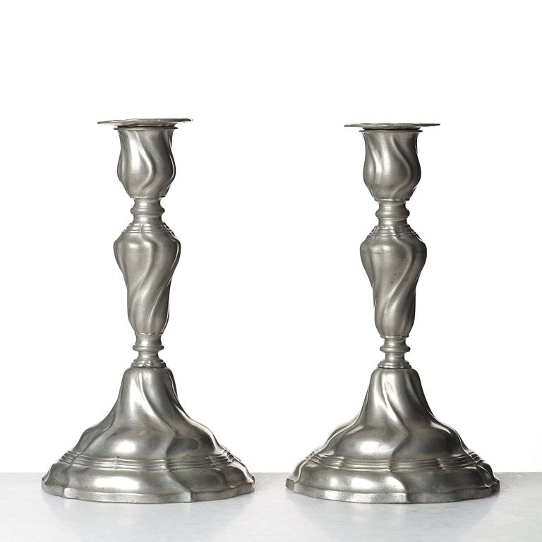 A pair of Swedish Rococo pewter candlesticks by E P Krietz, made in Stockholm 1772.