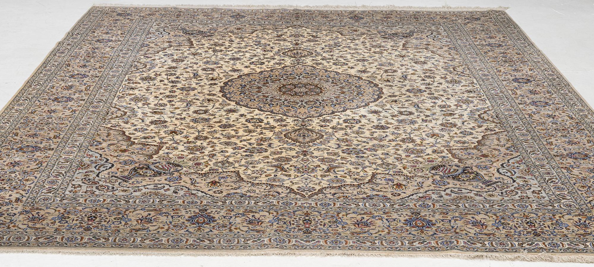 A semi-antique silk Keshan carpet, c. 350 x 248 cm.