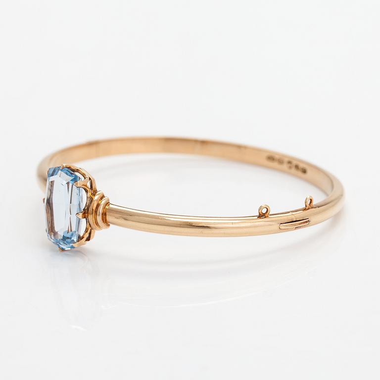 Rannekoru, 14K kultaa, synteettinen spinelli. Westerback, Helsinki 1940.