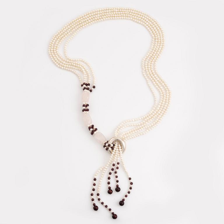 Pearl necklace, freshwater pearls, garnet and wooden beads, rose quartz. Pendant, Elsa Peretti, Tiffany & Co.