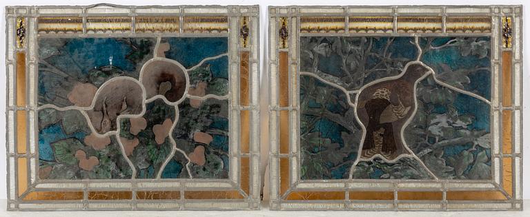 A pair of stained glass windows, circa 1900.
