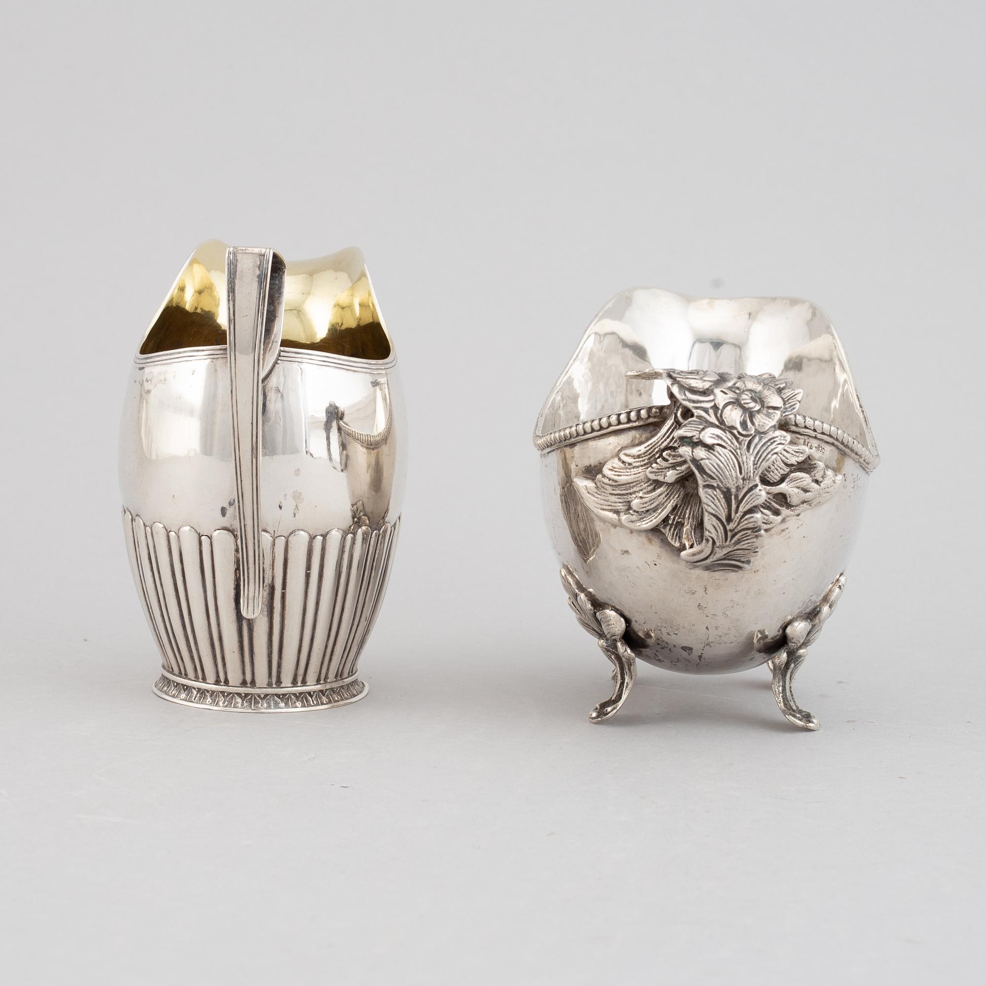 Two creamers, silver, one german and one Johan Petter Grönvall, Stockholm 1827.