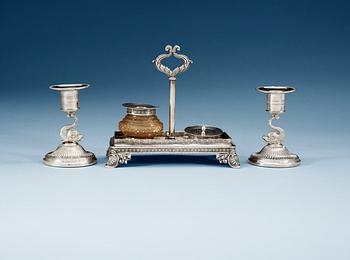 838. A SWEDISH SILVER WRIGHTING-STAND AND A PAIR OF CANDLESTICKS, Makers mark of Gustaf Möllenborg, Stockholm 1830 and Adolf Zethelius, Stockholm 1812. Provenance: Fredrika Bremer.