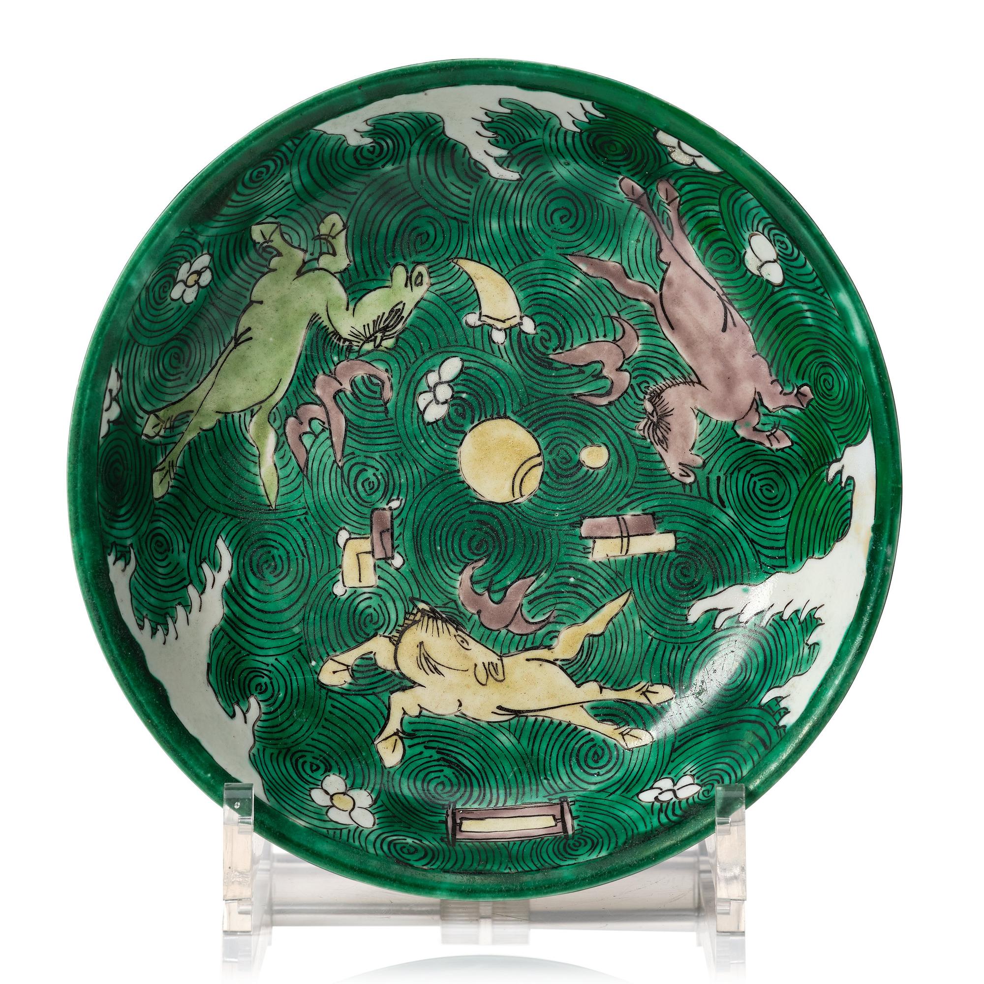 A green yellow and aubergine glazed dish with flying horses, Qing dynasty, Kangxi (1662-1722).