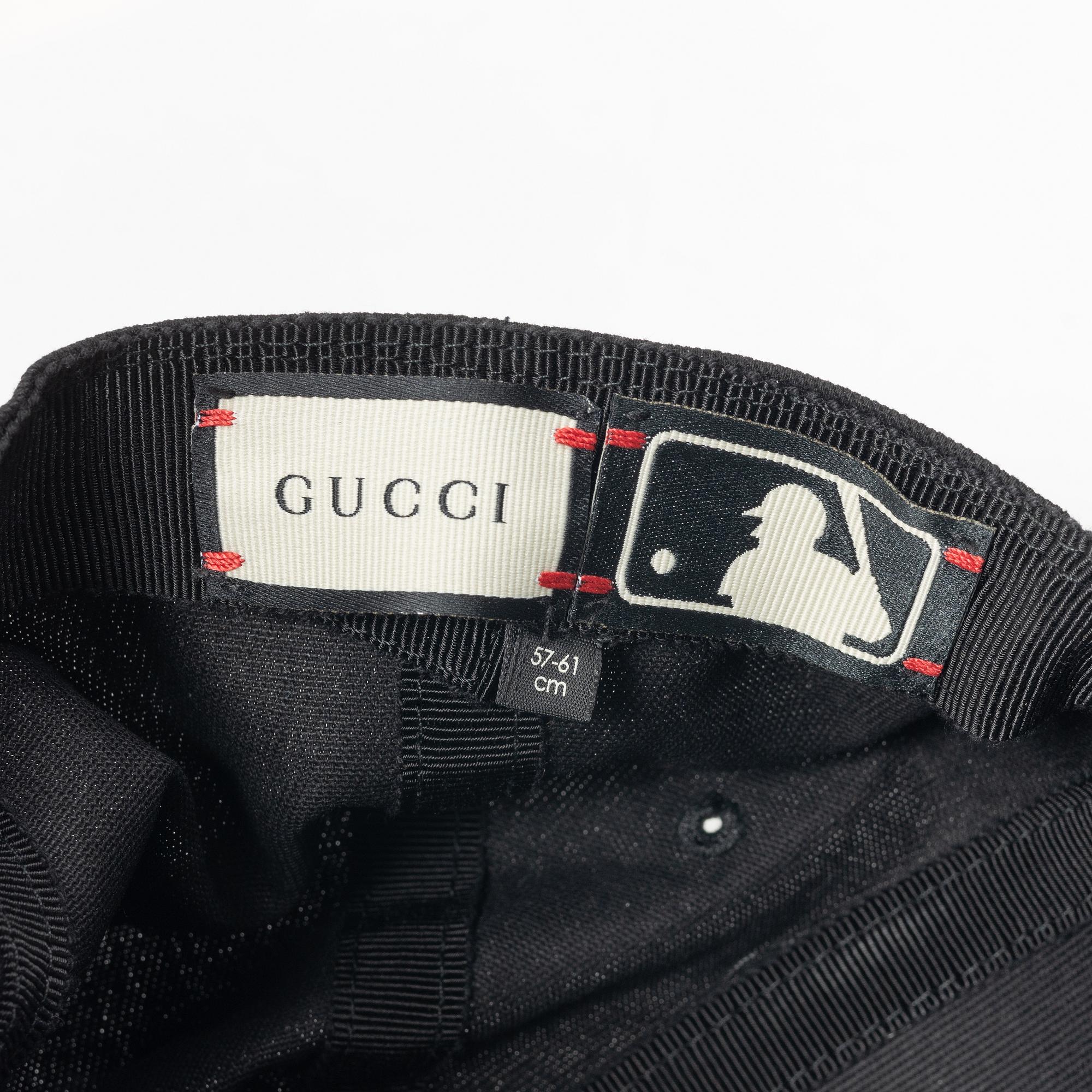 Gucci, NY Yankees baseball cap.