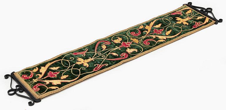 A 17th century Spanish embroidered velvet panel, c. 77 x 18.5 cm.