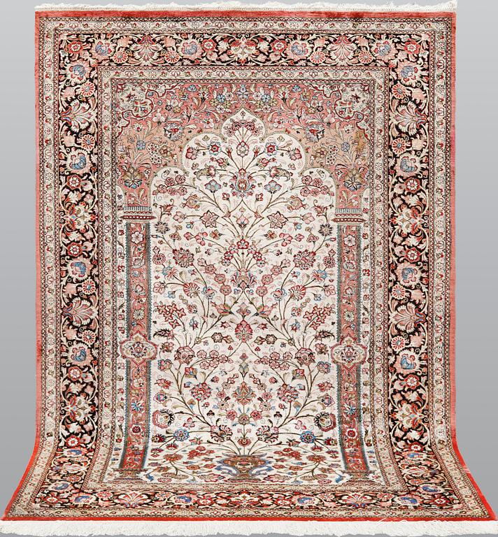 A Ghom silk carpet, approx. 206 x 135 cm.