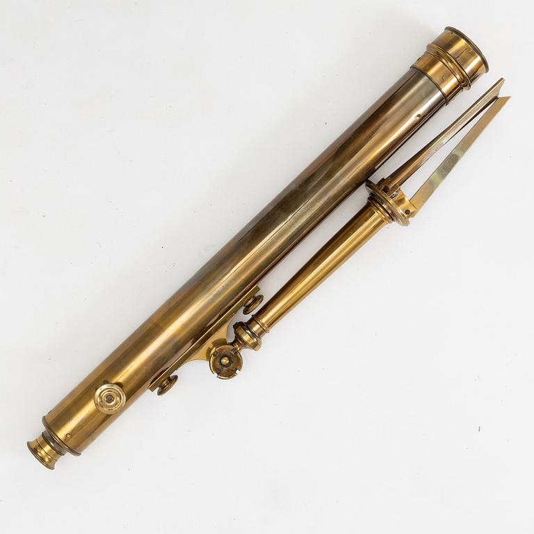 A telescope on a tripod, 19th/20th century.