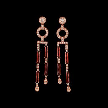 141. A pair of diamond, circa 2.40 ct, and garnet earrings.