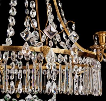 A German Louis XVI ormolu and cut-glass nine-light chandelier attributed to Johann Christoph Ermisch, late 18th century.