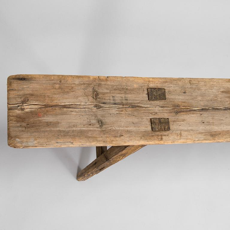 A folk art bench, circa 1900.