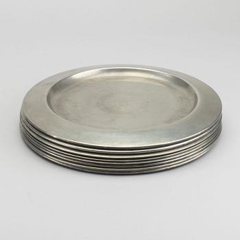 FIRMA SVENSKT TENN, A set of eight 1960s pewter plates by Firma Svenskt Tenn.