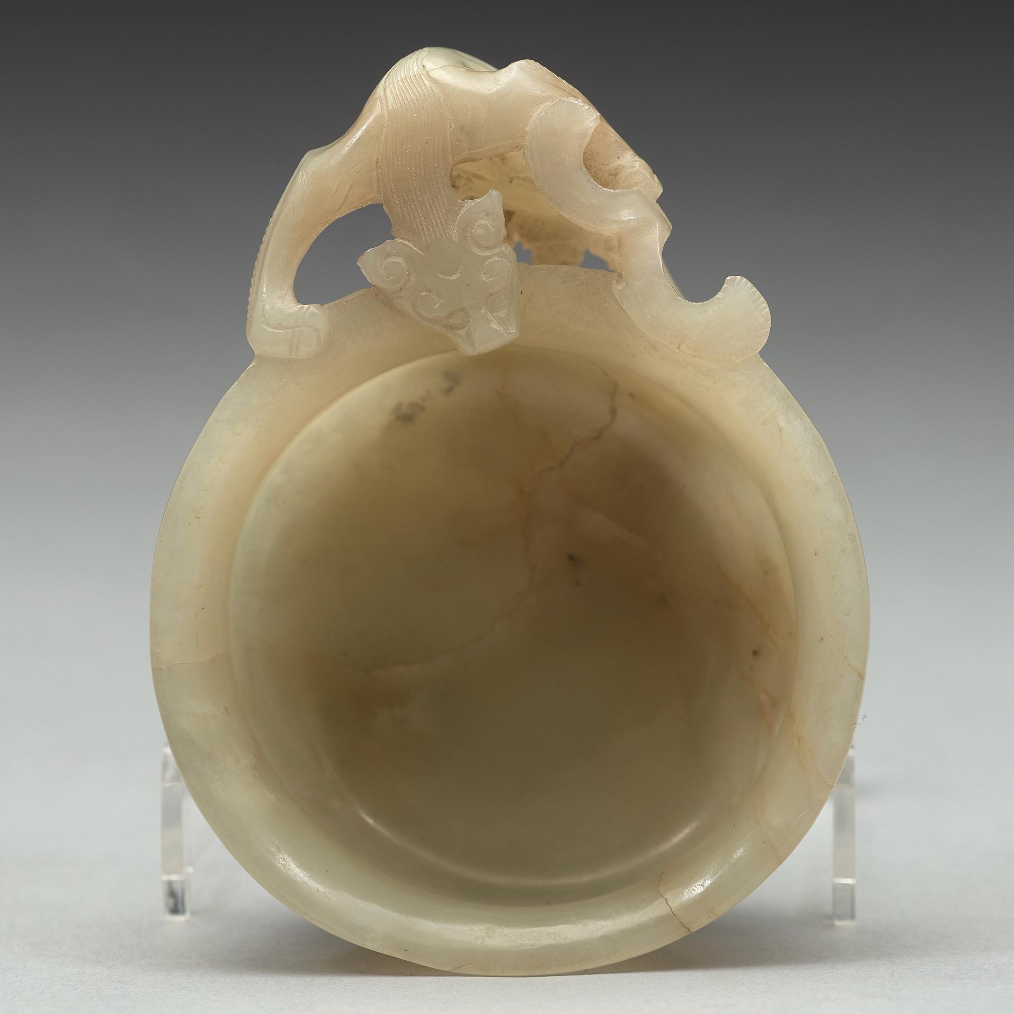 A nephrite cup and figurine, China, early 20th Century.