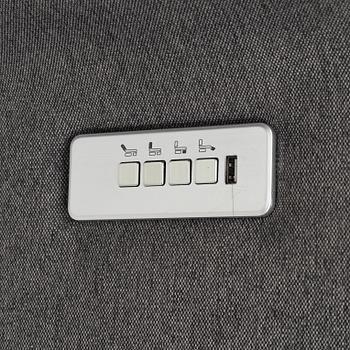 An easy chair with electrical adjustment.