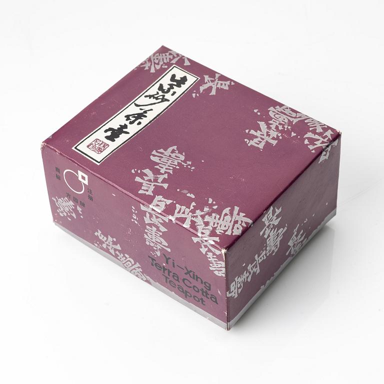 A group of three yixing teapots and a box with cover, China, 1970/80s.