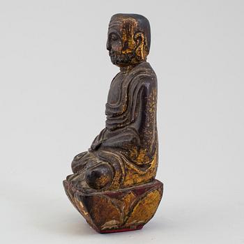 A wooden Japanese sculpture of a deity, 19th Century.