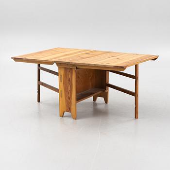 A pine gateleg table, 19th Century.