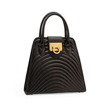 JEAN MICHEL NOUVEAU, a black leather top handle purse.