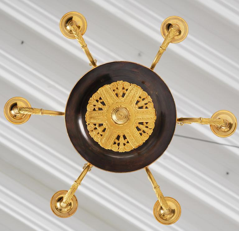 A Swedish Empire ormolu and patinated six-branch chandelier, Stockholm, early 19th century.