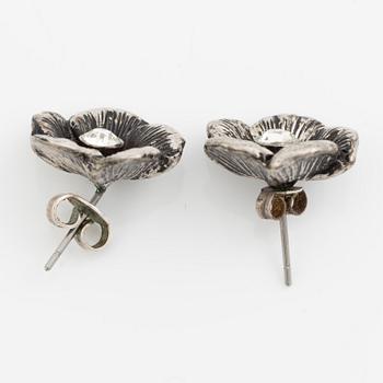 Necklace with matching earrings, white metal in floral design with glass stones.