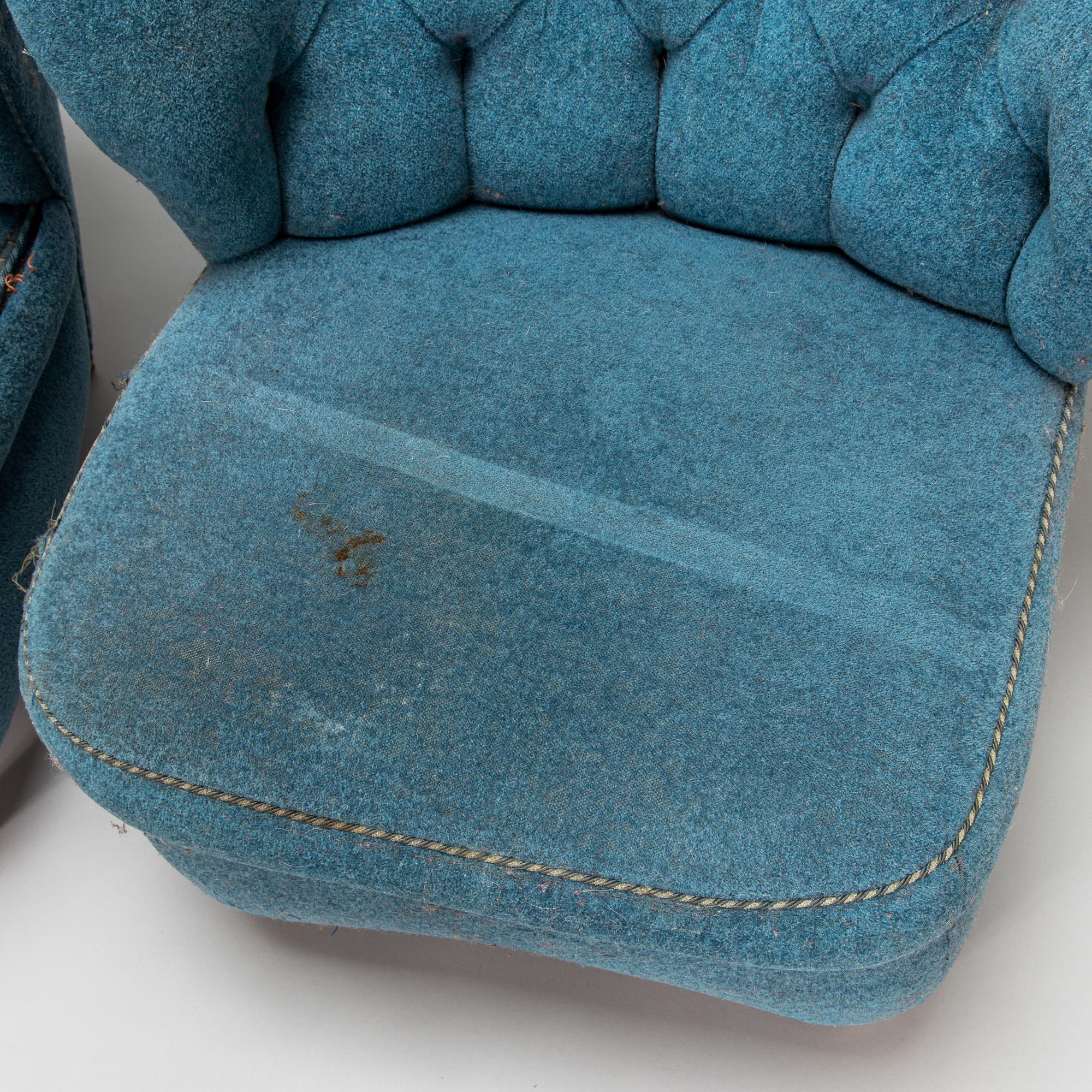 A pair of mid-20th-century armchairs.
