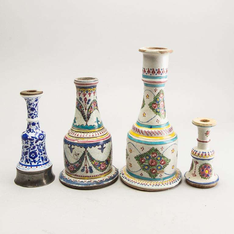 A set of four persian ceramic water pipe bottles and a dish, early 20th Century. Chinoiserie.