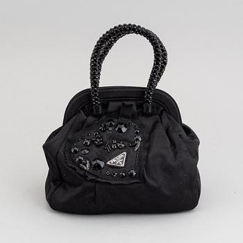 Prada, an evening bag.