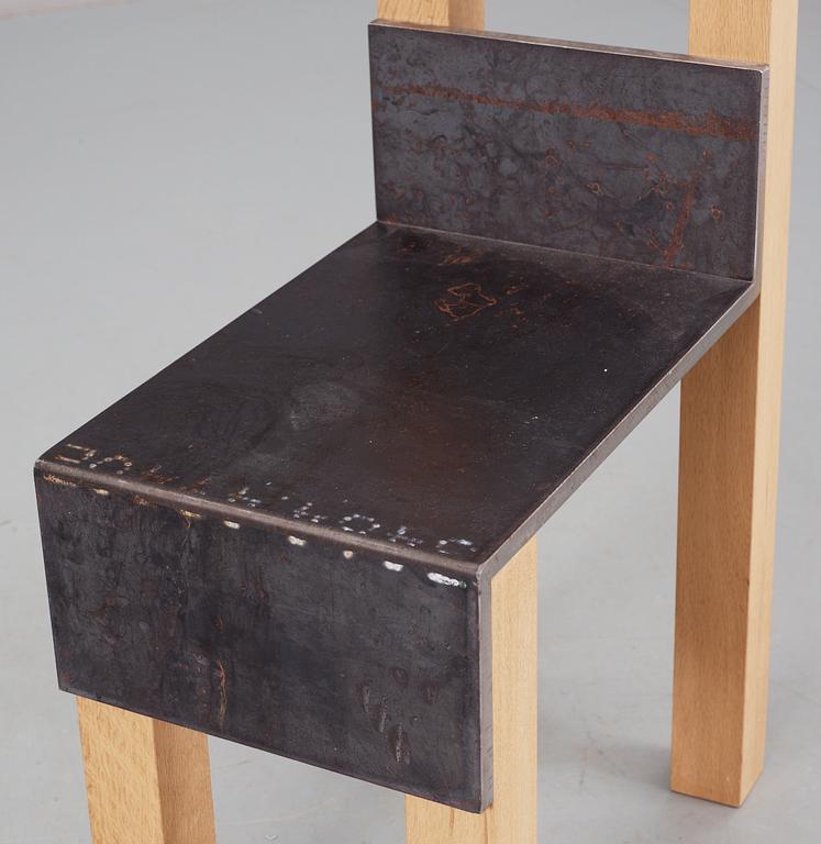 A Jonas Bohlin 'Sto' iron and oak chair, Stockholm 1990.