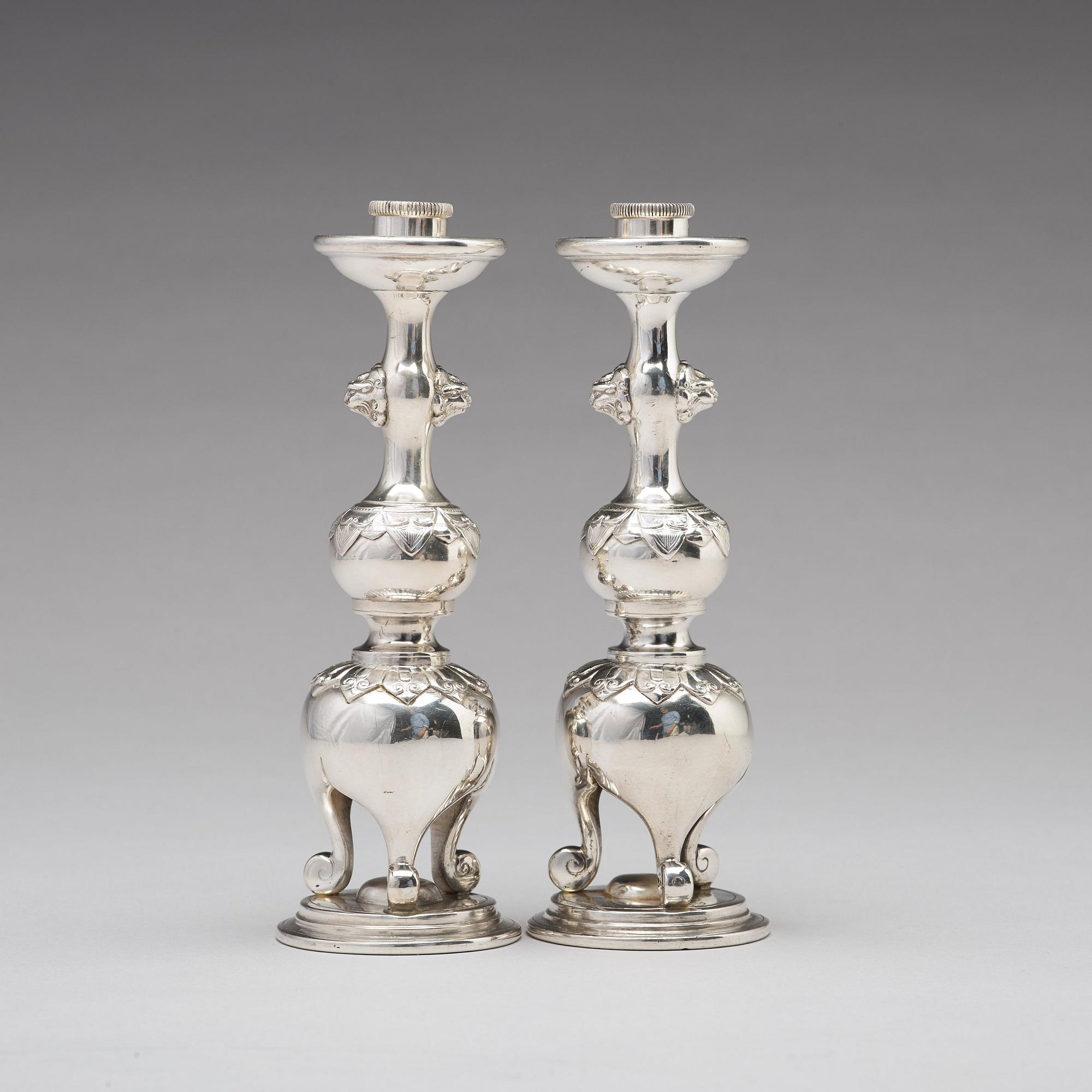 A pair of Chinese silver candle sticks, Shanghai, early 20th Century.