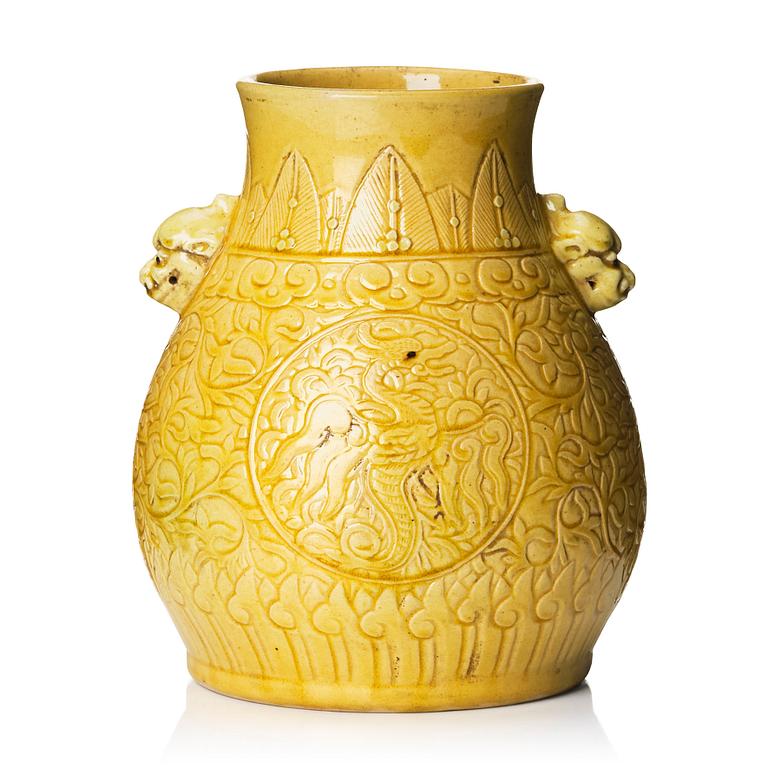 A yellow glazed phoenix vase,  Qing dynasty, with a Kangxi mark.