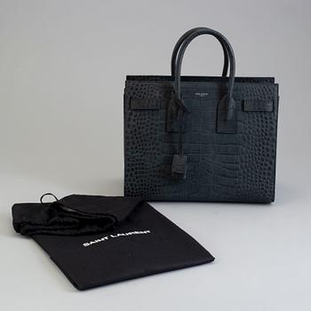 A bag by Yves Saint Laurent, "Sac du jour".