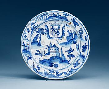 1321. An armorial faiance charger, 18th Century, presumably Dutch.