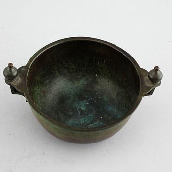 A bronze bowl by GAB, from the first half of the 20th century.