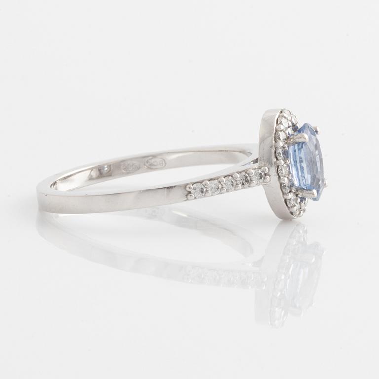 Ring with oval sapphire and brilliant-cut diamonds.