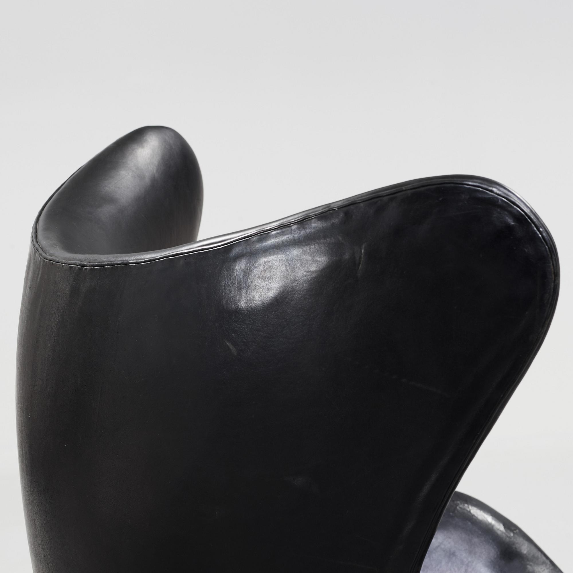 An Arne Jacobsen black leather 'Egg' chair, Fritz Hansen, Denmark 1960's.