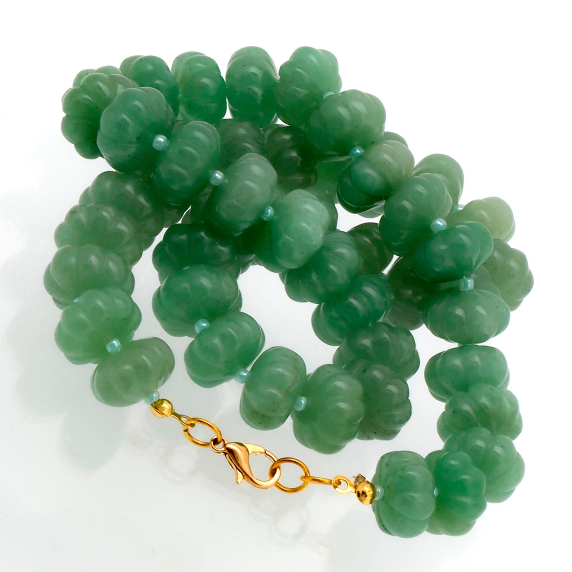 Necklace carved jade beads approx 15 mm and smaller glass beads , clasp metal, approx 50 cm.