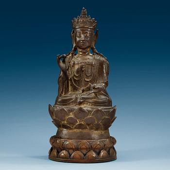 1775. A bronze figure of Guanyin, Ming dynasty with archaistic lettering to back.