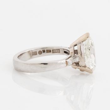 A platinum ring set with a pear shaped old-cut diamond weight ca 3.00 cts quality ca I si2.