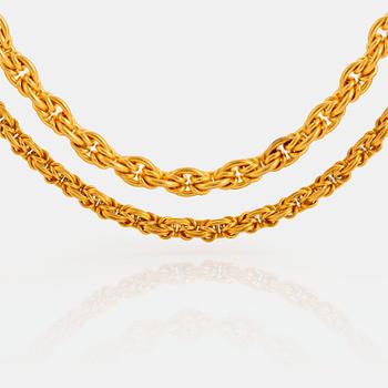 1129. Two 14K gold chains.