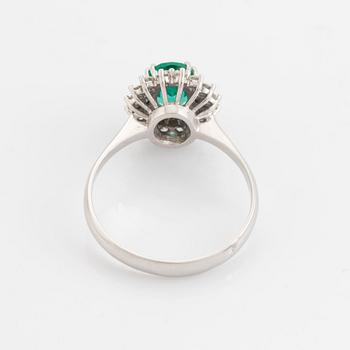 Emerald and brilliant cut diamond  cluster ring.