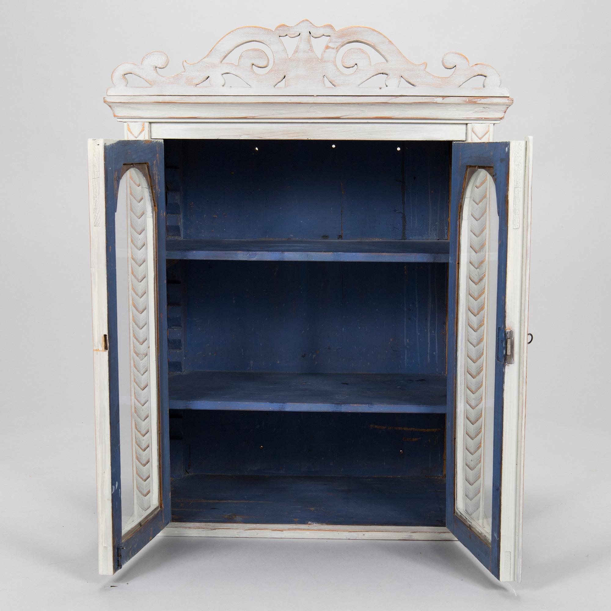 A late 19th-century wooden wall cabinet.