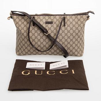 Gucci, a canvas tote bag.